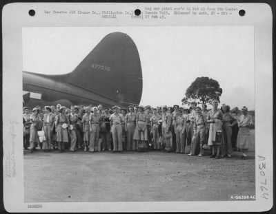 Thumbnail for Consolidated > Manila, Philippine Islands - The Nurses Mill Around The Plane Which Is To Take Them Home. The Plane, A Huge Curtiss C-46 Landed On One Of Manila'S Broad Streets In The Town'S Outskirts And Took The Liberated Nurses Off On The First Leg Of Their Trip Home.