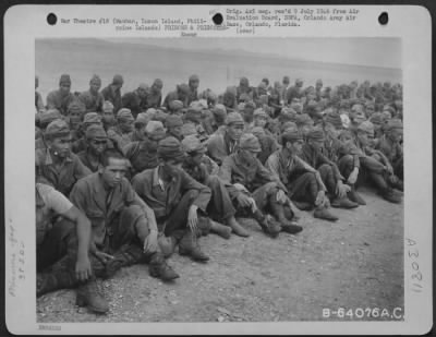 Thumbnail for Consolidated > Jap Prisoners Were Brought From The Point Of Their Surrender To Mauban By Lcis From Where They Were To Be Carried To Bilibid Prison By Truck.  After Being Unloaded From Lcis, They Were Seated Upon The Ground By Command Of Their Own Officers.  This Was Don