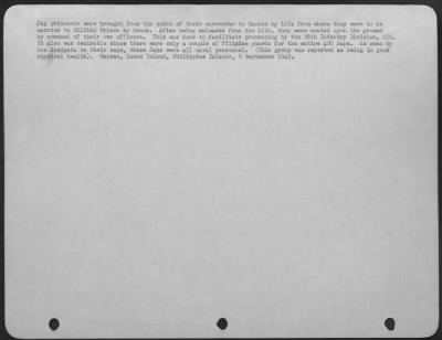 Consolidated > Jap Prisoners Were Brought From The Point Of Their Surrender To Mauban By Lcis From Where They Were To Be Carried To Bilibid Prison By Truck.  After Being Unloaded From Lcis, They Were Seated Upon The Ground By Command Of Their Own Officers.  This Was Don