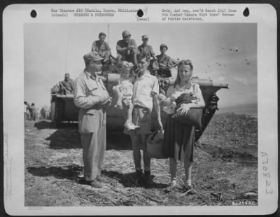 Consolidated > Mr. & Mrs. Michael O'Hara And Children Of Philadelphia, Pa., Liberated From A Prison Camp At Manila, Luzon, Philippine Islands, Are Interviewed By An Army Representative Before Boarding An Amtrack For New Bilibid Prison Where They Will Receive Food And Sh