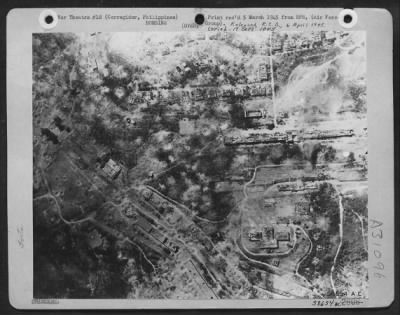 Thumbnail for Consolidated > Picture Of The Recaptured Garrison Area On Corregidor In The Philippines Is Taken By A Cameraman Aboard A Fightin' 13Th Aaf Consolidated B-24 Liberator Bomber. Bomb-Gutted Buildings And Craters Testify To The Effectiveness Of The Air Strikes.