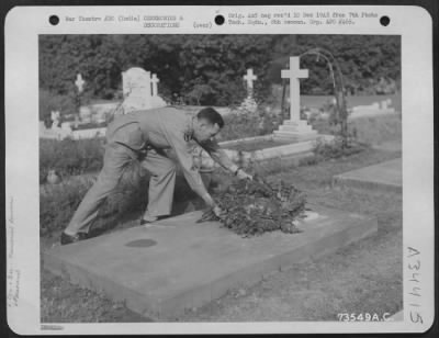 Consolidated > Major General Clayton L. Bissell Lays A Floral Wreath On One Of The Graves During Decoration Dat Ceremonies At A Cemetery Somewhere In India.