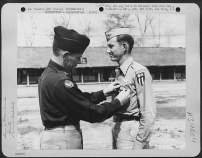 Thumbnail for Consolidated > An Officer Presents The Distinguished Flying Cross To A Member Of The 1330Th Aaf Base Unit, Air Transport Command, During A Ceremony At An Airbase At Jorhat, Assam, India. 20 March 1945.