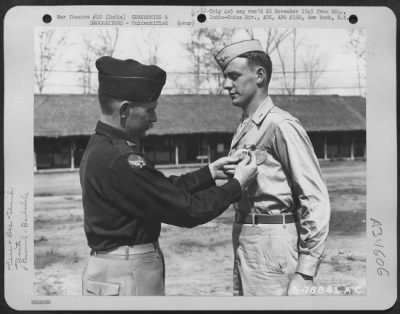 Thumbnail for Consolidated > An Officer Presents The Distinguished Flying Cross To A Member Of The 1330Th Aaf Base Unit, Air Transport Command, During A Ceremony At An Airbase At Jorhat, Assam, India. 20 March 1945.