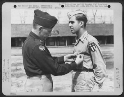 Thumbnail for Consolidated > An Officer Presents The Distinguished Flying Cross To A Member Of The 1330Th Aaf Base Unit, Air Transport Command, During A Ceremony At An Airbase At Jorhat, Assam, India. 20 March 1945.