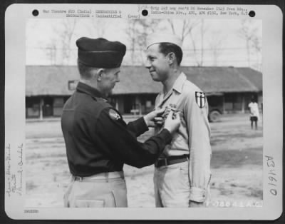 Consolidated > An Officer Presents The Air Medal To A Member Of The 1330Th Aaf Base Unit, Air Transport Command, During A Ceremony At An Airbase At Jorhat, Assam, India. 20 March 1945.