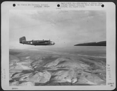 Thumbnail for Consolidated > Berteaux, Morocco-North American B-25's of the 310th Bomber Group on a mission over Axis held North African territory.