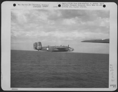 Consolidated > Berteaux, Morocco-North American B-25's on their way to Axis held territory from a bomber base somewhere in North Africa.