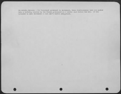 Consolidated > Marrakech, Morocco-For transient personnel in Marrakech, these double-decker beds are packed into a building erected by the French government as a casino just before the war. It was intended to make Marrakech a rich man's winter playground.