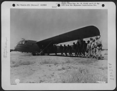 Thumbnail for Consolidated > AIRBORNE TROOPS ENTERING GLIDER . . . . Troops of the Glider Field Artillery Battalion, enter a glider at Oujda Airdrome for invasion maneuvers. Invasion training under direction of 5th Army, commanding by Lt. Gen. Mark W. Clark. Oujda, Morocco