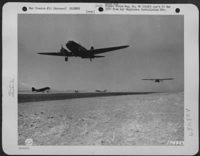 Thumbnail for Consolidated > EQUIPMENT AND TROOP GLIDERS OF THE 82ND AIRBORNE DIVISION . . . Plane towing equipment and troops carrying glider. Invasion training under direction of 5th Army, commanded by Lt. Gen. Mark W. Clark. Oujda, Morocco, North Africa