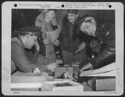 Thumbnail for Consolidated > Berteaux, Morocco-After successful raid over Axis held territory in North Africa, a crew of the 379th Bomb Squadron, 310th Bomb Group is being quizzed by 1st Lt. Rupert A. Nock at bomber headquarters.