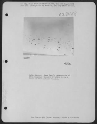 Consolidated > Oujda, Morocco-Mass jump by parachutists of 504th Parachute Infantry Battalion during a review of 82nd Airborne Division.