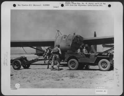 Consolidated > Members Of The 82Nd Airborne Division Preparing To Load 75Mm Howitzer Into Glider, During Invasion Training Under Direction Of 5Th Army, Commanded By Lt. Gen. Mark W. Clark, Oujda, Morocco, North Africa, 11 June 1943.