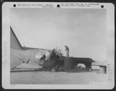 Consolidated > Photo of the wreckage of a Douglas C-47 at Biskra, North Africa which burned after a direct bomb hit by German planes. 15 January 1943.