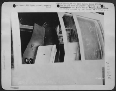 Thumbnail for Consolidated > Armor screen for pilots is one of the extensive modifications made by the ASC on North American B-25's in Africa. Other armor was added to protect instrument panel.