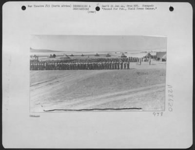 Thumbnail for Consolidated > Presentation of awards and decorations to American Flying Fortress personnel at an advanced U.S.A.A.F. flying field "Somewhere in North Africa." Scene was taken at one of the numerous airdromes that dot the flat valleys of Northern Algeria and