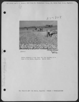 Thumbnail for Consolidated > Arabs prepare a rock base for the taxiway at a base in La Senia, Algeria. March 1943.