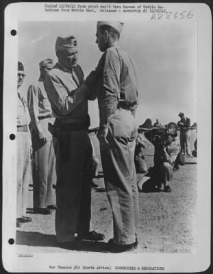 Thumbnail for Consolidated > 2nd Lt. Robert E. Longstreuth, navigator, of Los Angeles, Calif., being awarded the Silver Star by Lt. General Frank M. Andrews, Commanding General of U.S. Army Forces in the Middle East at an advanced air base somewhere in the Middle East.