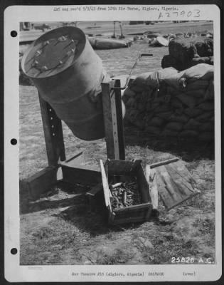 Consolidated > Algiers, Algeria-Reclamation drum for the cleaning and salvaging of small parts such as nuts and bolts, washers, etc. April 1943.