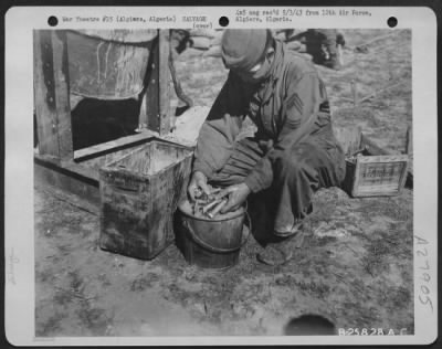 Thumbnail for Consolidated > Algiers, Algeria-Salvage parts being washed after cleaning in reclamation drum used for cleaning and salvaging small parts such as nuts and bolts, washers, etc. April 1943.