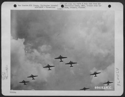 Consolidated > Douglas C-47's of the 317th Troop Carrier Group approach the drop zone; soon paratroopers will cascade earthward from these planes. 30 September 1944, Luzon, Philippine Islands.