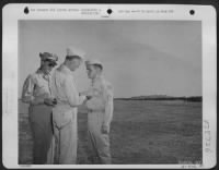 Thumbnail for S/Sgt. Francis E. Donahue, 416 N. Tacoma Ave., Indianapolis, Indiana, bombardier of a USAAF North American B-25 Mitchell bomber of Maj. Gen. Jimmy Doolittle's Bomber Command, is shown receiving the Distinguished Flying Cross from Lt. Gen. Carl A. - Page 1