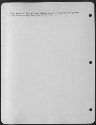 Consolidated > S/Sgt. Leonard J. Stevens, Sandy Valley, Ariz., receiving the Distinguished Flying Cross from Maj. Gen. Lewis H. Brereton.