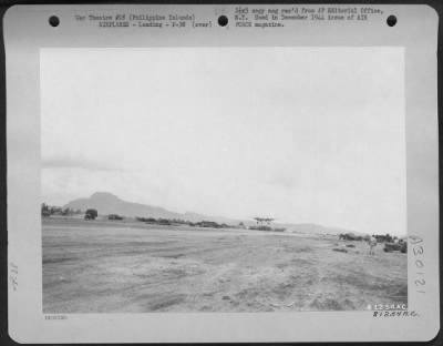 Thumbnail for Consolidated > A Lockheed P-38 "Lightning" comes in for a landing at Leyte, Philippine Islands. This was the first fighter to land on the strip at Leyte.