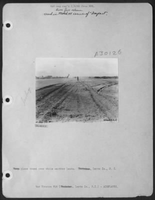 Thumbnail for Consolidated > Navy plane nosed over while another lands. Leyte Is., P.I.