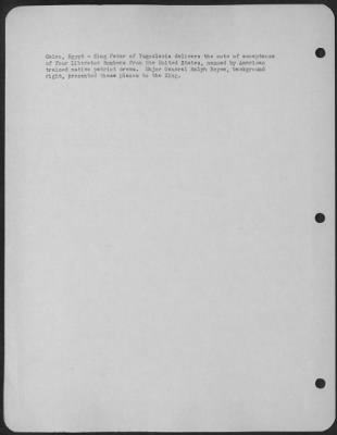 Consolidated > Cairo, Egypt-King Peter of Yugoslavia delivers the note of acceptance of four Liberator Bombers from the United States, manned by American trained native patriot crews. Major General Ralph Royce, background right, presented these planes to the King.