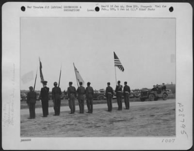 Consolidated > On his recent trip to Africa, President reviewed British, French, and American Army Air Force Units. Here is the President in a jeep with General Dwight D. Eisenhower and Lt. General Carl Spaatz reviewing the Allied color of honor.