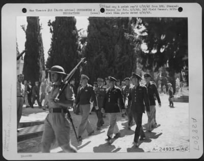 Consolidated > Part of the Memorial Day services for unknown American Soldiers killed in the North African Campaign. Lt. Gen. Carl Spaatz and Maj. Gen. James Doolittle are shown here at the service.