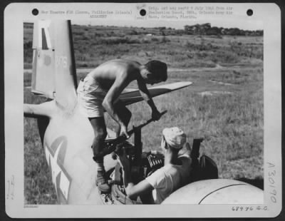 Thumbnail for Consolidated > Armorers remove the gun barrel from a .50 cal gun in the top turret of a Douglas A-20, parked on Clark Field, Luzon, Philippine Islands. 9 August 1945.