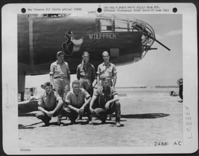 Consolidated > With Major General Doolittle's Mitchell Bombers, 19 June. Shown above are victory claimants in yesterday's successful Mitchell raid on Aranci. Left to right: (Front row) S/Sgt. Alfred A. Szezesniak, Detroit, Mich., Me-109 S/Sgt. Loy G. Myers, Hume