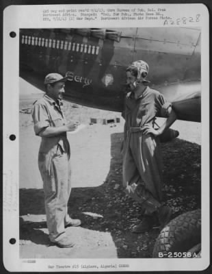 Thumbnail for Consolidated > 2nd Lt. Joseph Carperelli, 95 Park Ave., Harrison, New York talks with his crew chief, S/Sgt. John Gilson, Hamburg, Iowa. Lt. Carparelli flies one of the new North American A-36 fighter-bombers that proved itself in the Sicilian campaign.