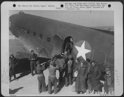 Consolidated > Cairo, Egypt-Loading British wounded into an American transport which will take them back to the first aid centers.