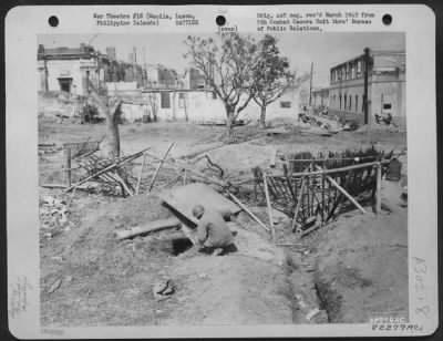 Consolidated > The intricate maze of Japanese defenses inside the west wall of Intramuros, at Manila, Luzon, Philippine Islands, was heavily defended and savagely fought over. U.S. troops searching house to house under steady fire from these positions had to kill