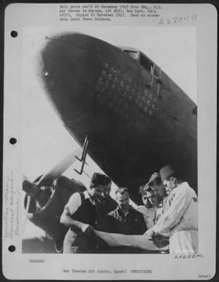 Consolidated > CAIRO, Egypt--Constant briefing is necessary to carry out spray missions daily in the areas hardest hit by the cholera epidemic. Here the crew of one of the specially-equipped USAFE C-47s get together with locatl Egyptian pilots at their Egyptian