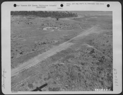 Thumbnail for Consolidated > The Japs had used kunai grass in a vain effort to camouflage this Jap "Dinah" parked on the edge of the strip at Clark Field, Luzon, Philippine Islands.