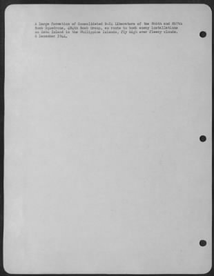 Consolidated > A Large Formation Of Consolidated B-24 Liberators Of The 866Th And 867Th Bomb Squadrons, 494Th Bomb Group, Enroute To Bomb Enemy Installations On Cebu Island In The Philippine Islands, Fly High Over Fleecy Clouds. 6 December 1944.