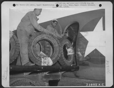 Consolidated > Cairo, Egypt-Tires being loaded aboard U.S. Army Transport to be rushed to our fighting forces in the desert of the Middle East.