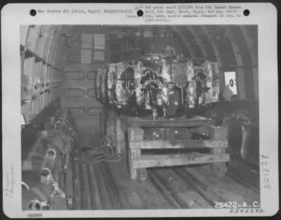 Consolidated > Cairo, Egypt-Pratt and Whitney motor aboard a U.S. Army Transport plane to be rushed to our fighting forces out in the desert in the Middle East.