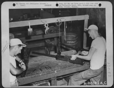 Thumbnail for Consolidated > Armament Men Repairing 50 Cal. Machine Guns At Clark Field, Philippine Islands.  8 August 1945.