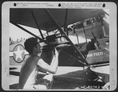 Thumbnail for Consolidated > An Inprovised Bomb Shackle On An L-4 Airplane That Flies In Support Of The 158Th Infantry.  The "Bombs" Are Bazookz Shells.  January 1945.