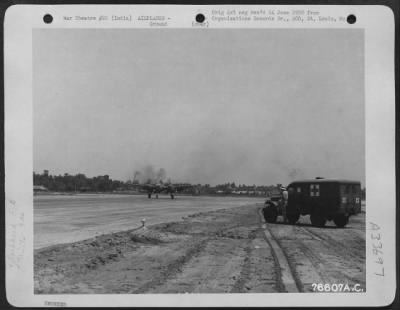 Thumbnail for Consolidated > An ambulance stands by as a Lockheed F-5 of the 9th Photographic Reconnaissance Squadron comes in for a landing at an air base somewhere in India.