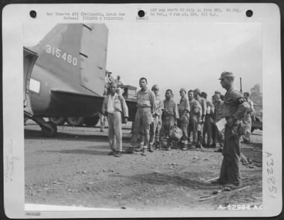 Thumbnail for Consolidated > Japanese prisoners of war from Biak Island being loaded at Hollandia, Dutch New Guinea, for transfer to Brisbane, Australia.