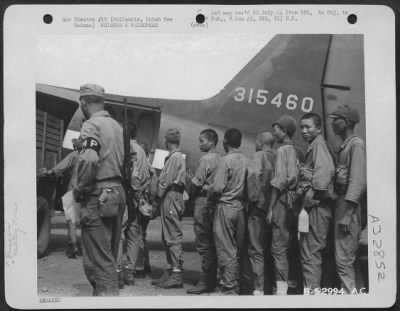 Thumbnail for Consolidated > Japanese prisoners of war being loaded aboard a Douglas C-47 for transfer to Brisbane. Photo taken at Hollandia, Dutch New Guinea.