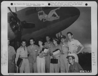 Thumbnail for Consolidated > Gary Cooper and party pose with the crew of the Douglas C-47 "Lazy Lady" beside the plane at Port Moresby, Papua, New Guinea. 7 December 1943. The group includes: Una Merkle (fourth from left); Gary Cooper (fifth from left); Capt. V.K. Riggs (seventh