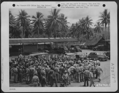 Thumbnail for Consolidated > Gary Cooper signing "short-snorter" bills for U.S. Troops at Milne Bay, New Guinea, during his tour of the Pacific Islands. 7 December 1943.